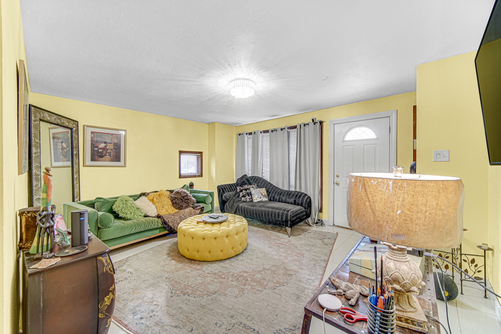 17423 Walter Street Lansing, IL 60438 - Photo 6 of 21 a living room with furniture and a flat screen tv