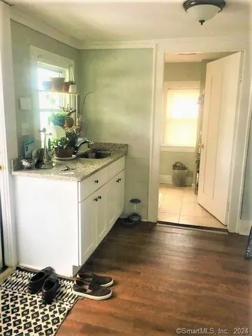 a kitchen with a sink and a refrigerator