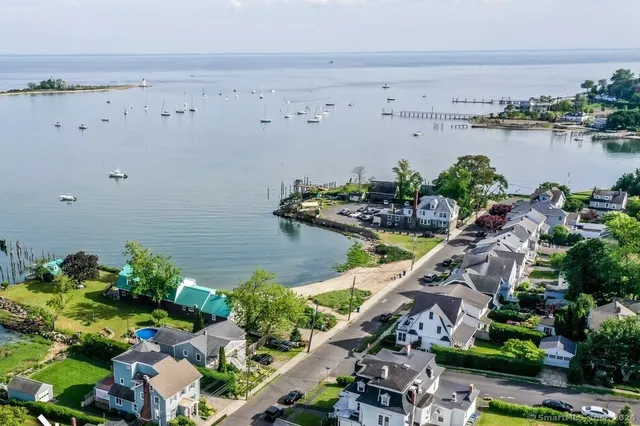an aerial view of a house with a lake view