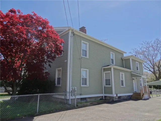a front view of a house with street
