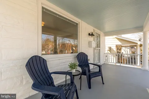 a view of a chair and dining room with furniture window and outside view
