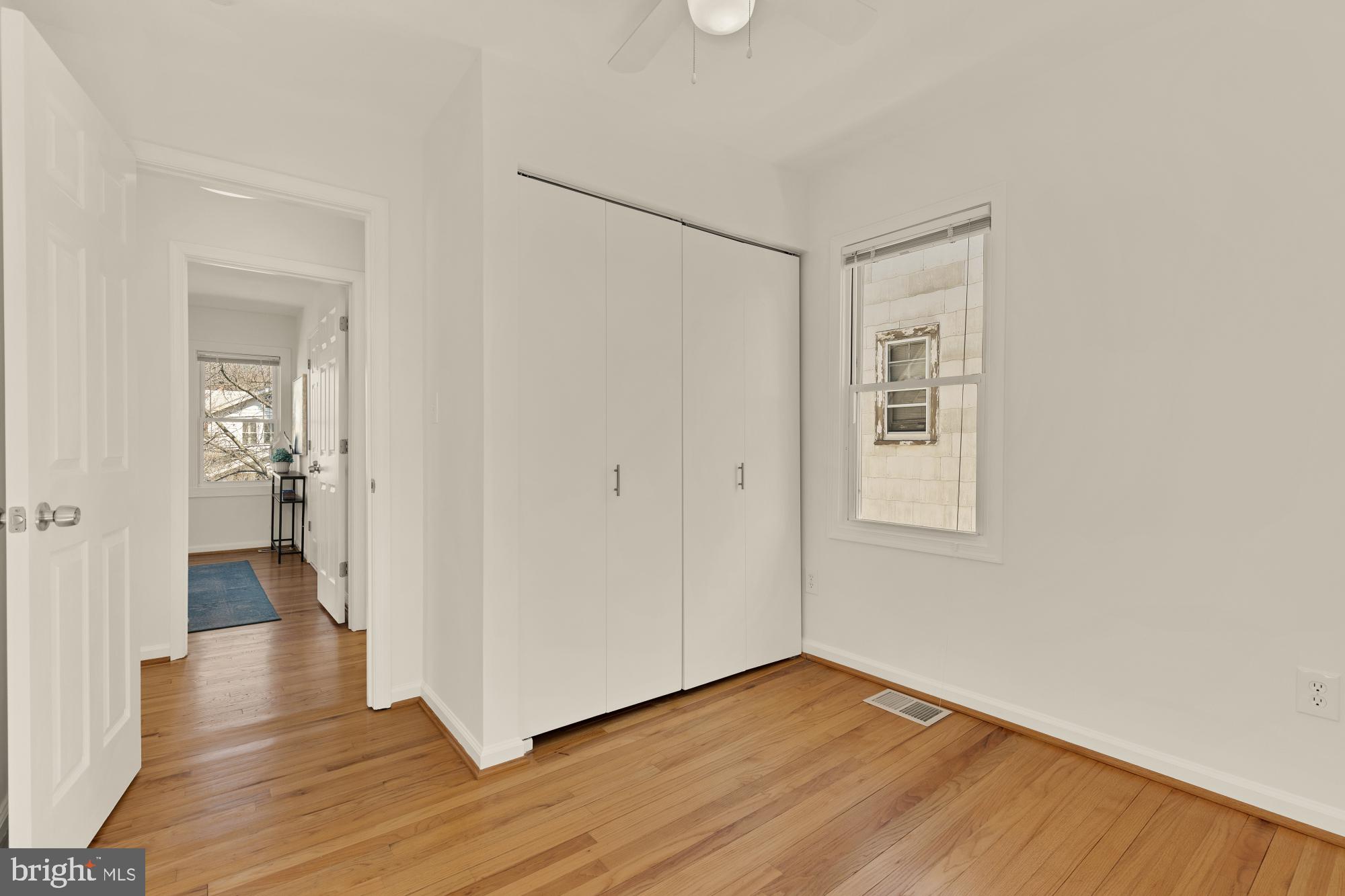 2425 Perry Street Northeast Washington, DC 20018 - Photo 23 of 43 a view of a room with wooden floor and a bathroom