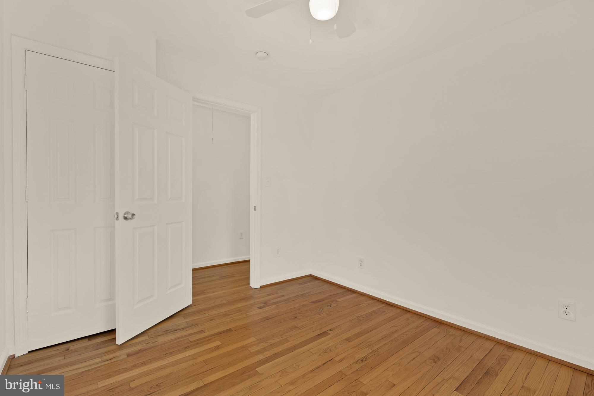 2425 Perry Street Northeast Washington, DC 20018 - Photo 25 of 43 a view of an empty room with wooden floor