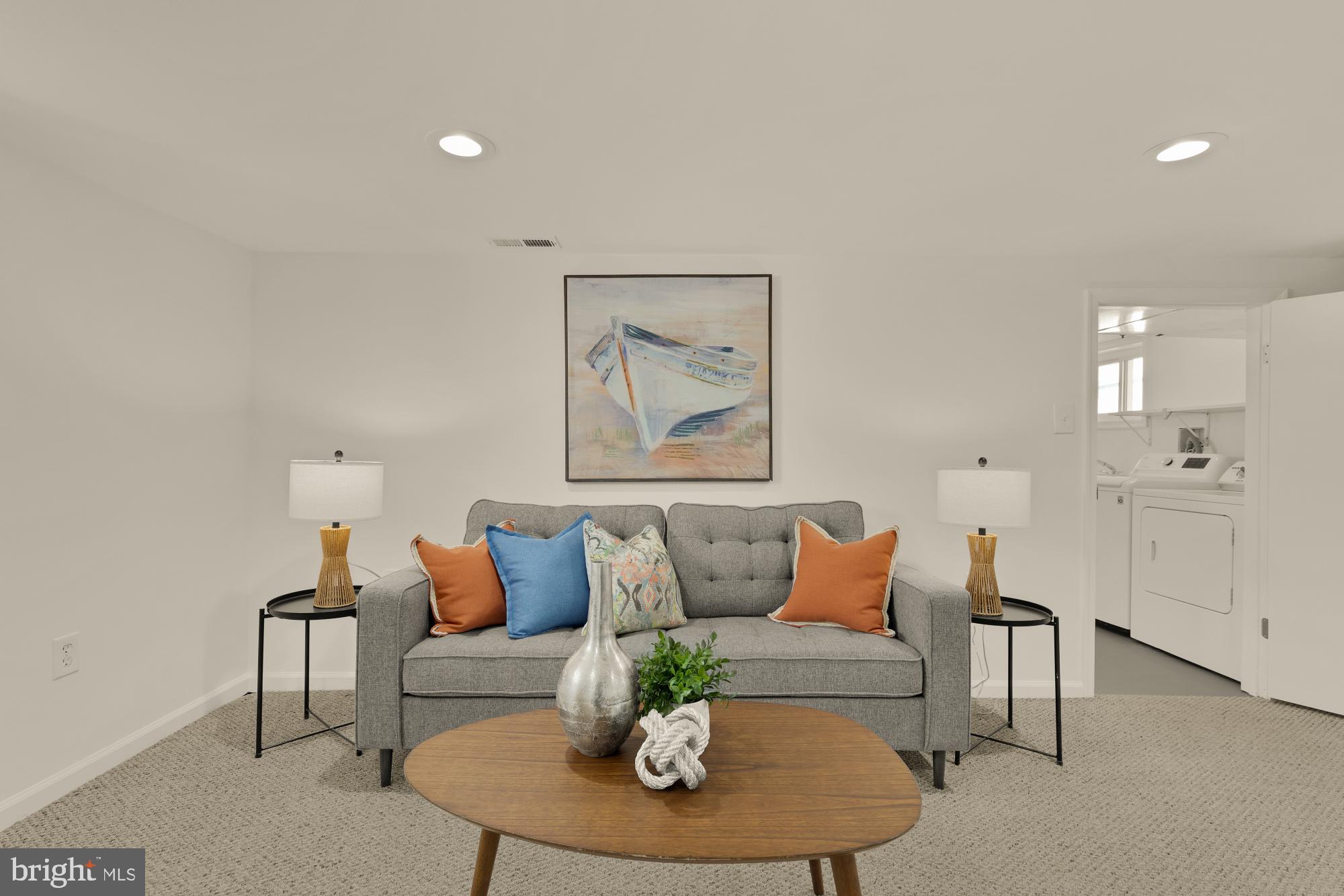 2425 Perry Street Northeast Washington, DC 20018 - Photo 30 of 43 a living room with furniture and a wooden floor