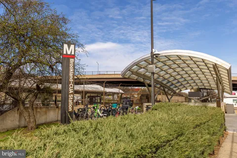 a view of a street with stores