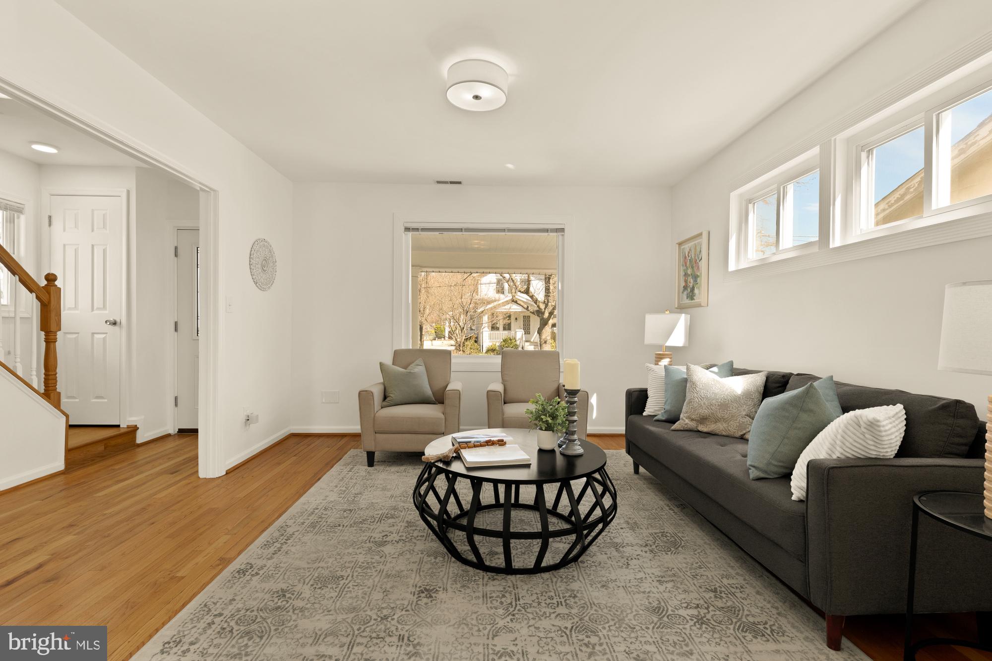 2425 Perry Street Northeast Washington, DC 20018 - Photo 6 of 43 a living room with furniture and a large window