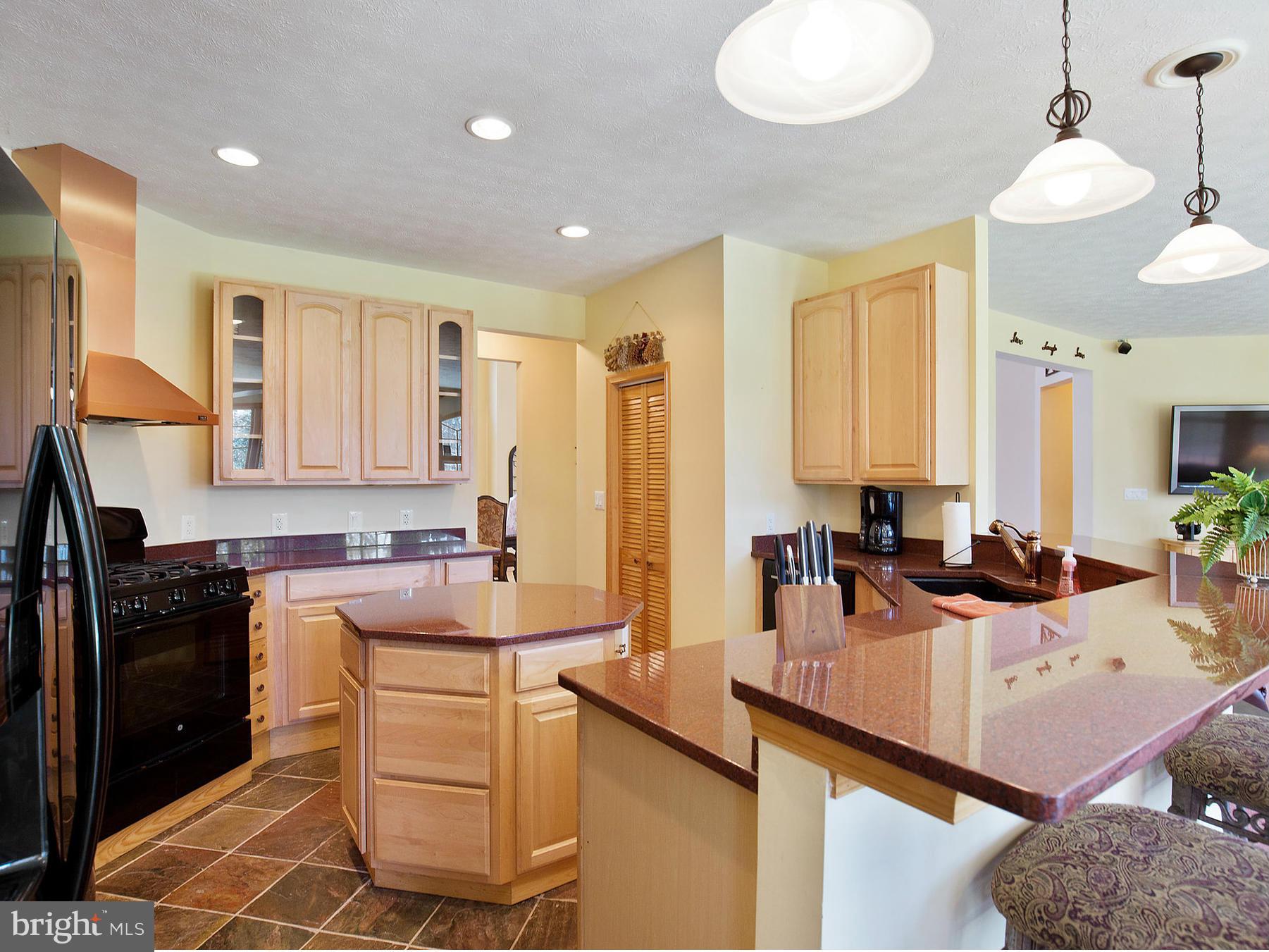 48510 Whitaker Road St. Inigoes, MD 20684 - Photo 13 of 30 a kitchen with a sink stove and cabinets