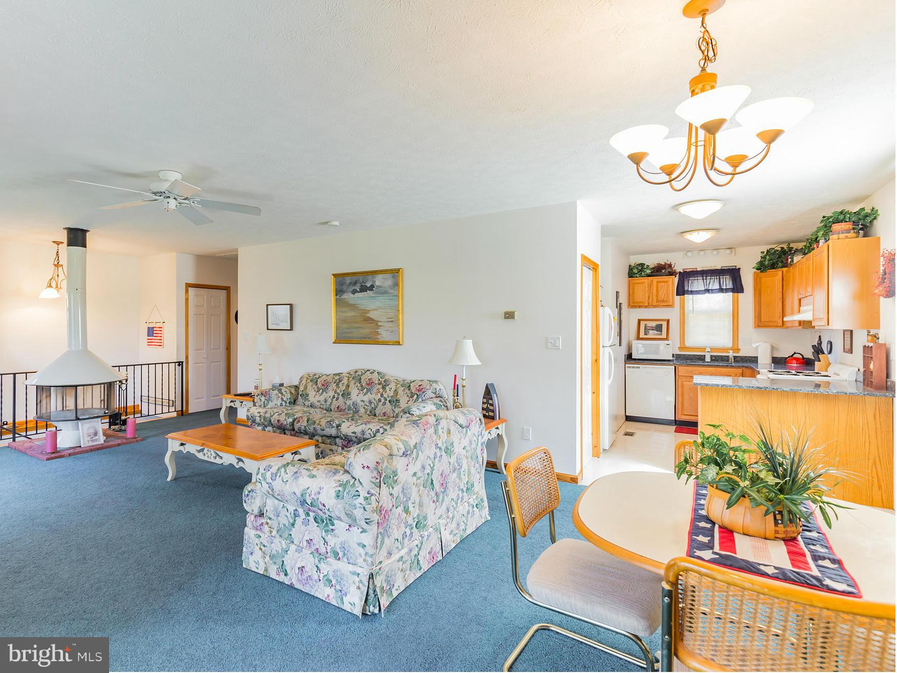 48510 Whitaker Road St. Inigoes, MD 20684 - Photo 24 of 30 a living room with furniture and a dining table