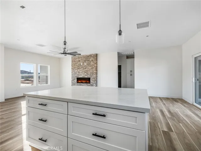 a view of room with cabinets and window