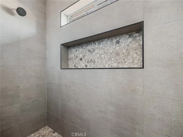 an empty room with a empty space and windows