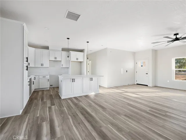 a view of kitchen with wooden floor