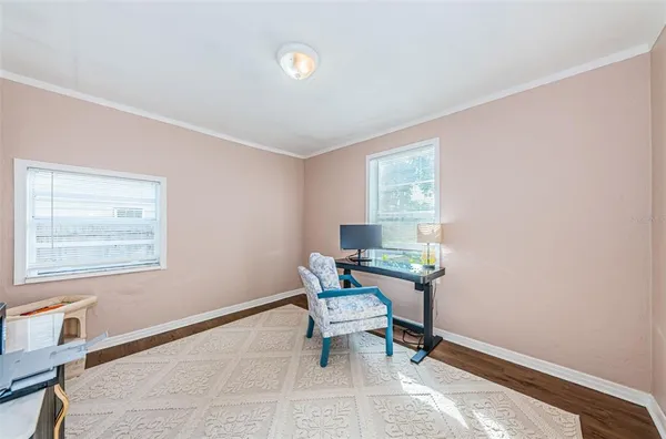 a work room with furniture and windows