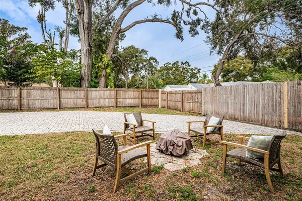 a view of a terrace with furniture and trees