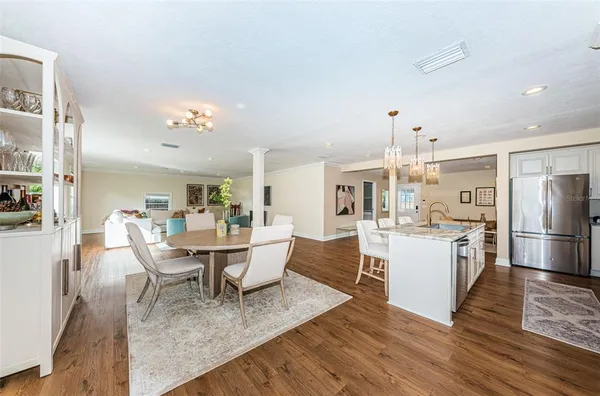 a view of a dining room with furniture and wooden floor