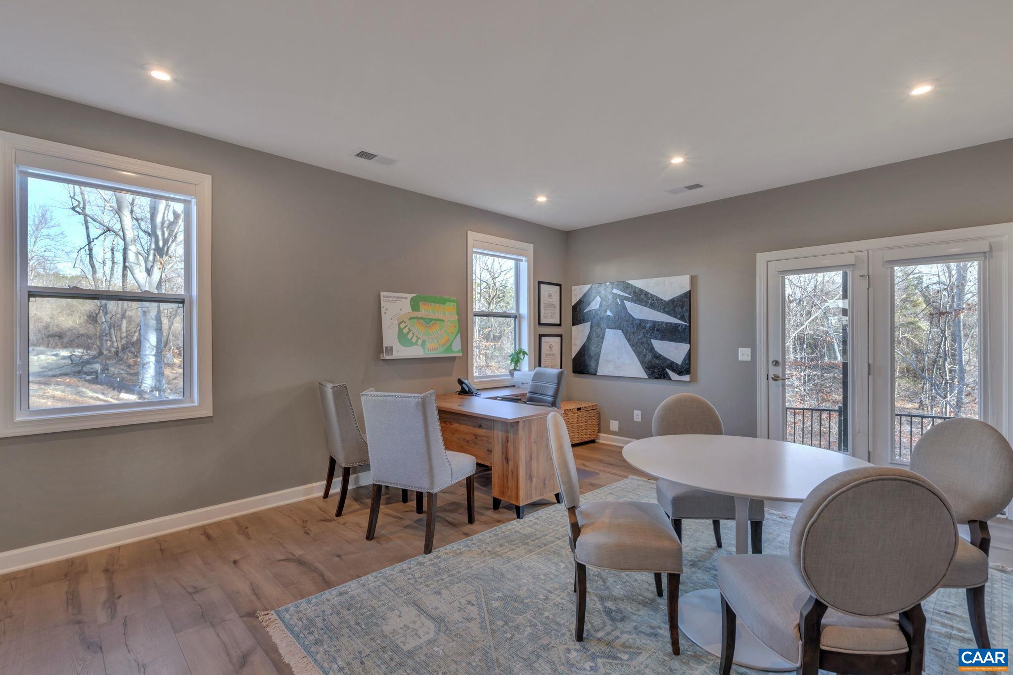 1842 Fowler Street Charlottesville, VA 22901 - Photo 11 of 44 a dining room with furniture a rug and wooden floor