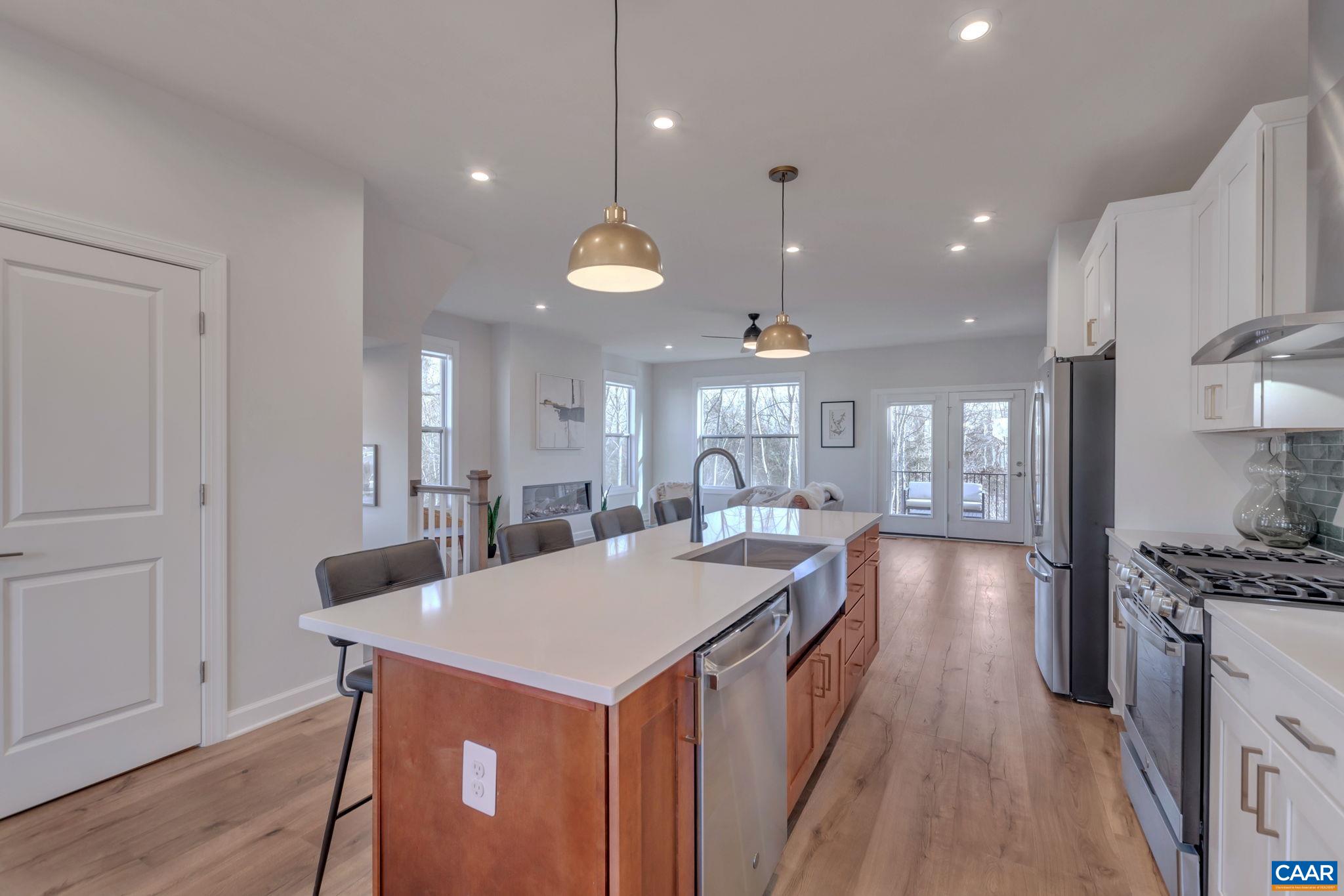 1842 Fowler Street Charlottesville, VA 22901 - Photo 15 of 44 a large kitchen with kitchen island a large island in it