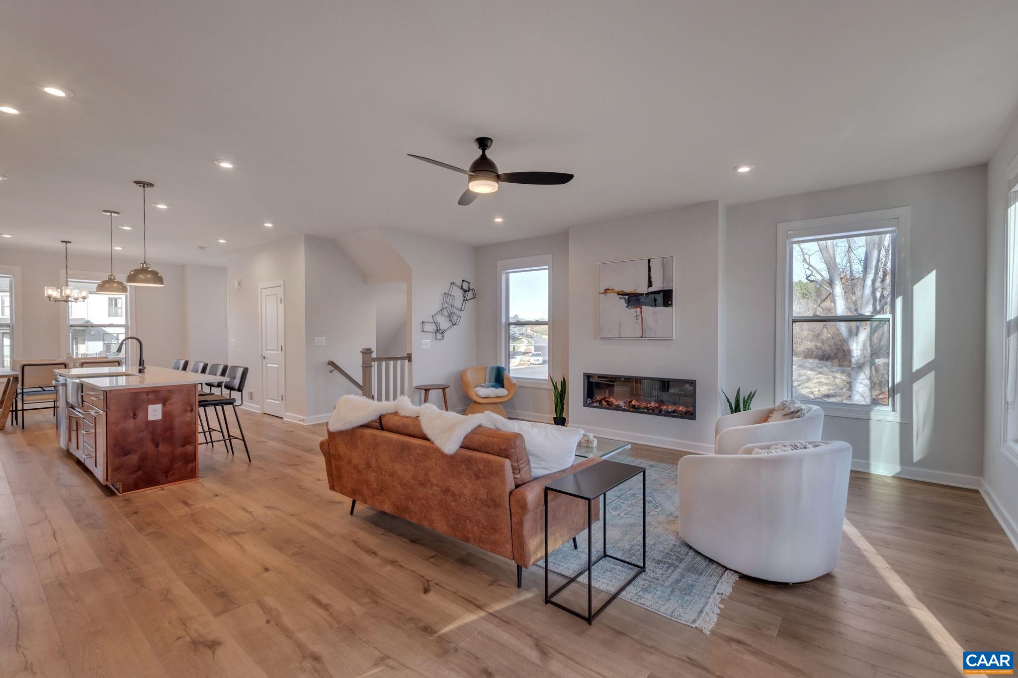 1842 Fowler Street Charlottesville, VA 22901 - Photo 23 of 44 a living room with fireplace furniture and a wooden floor