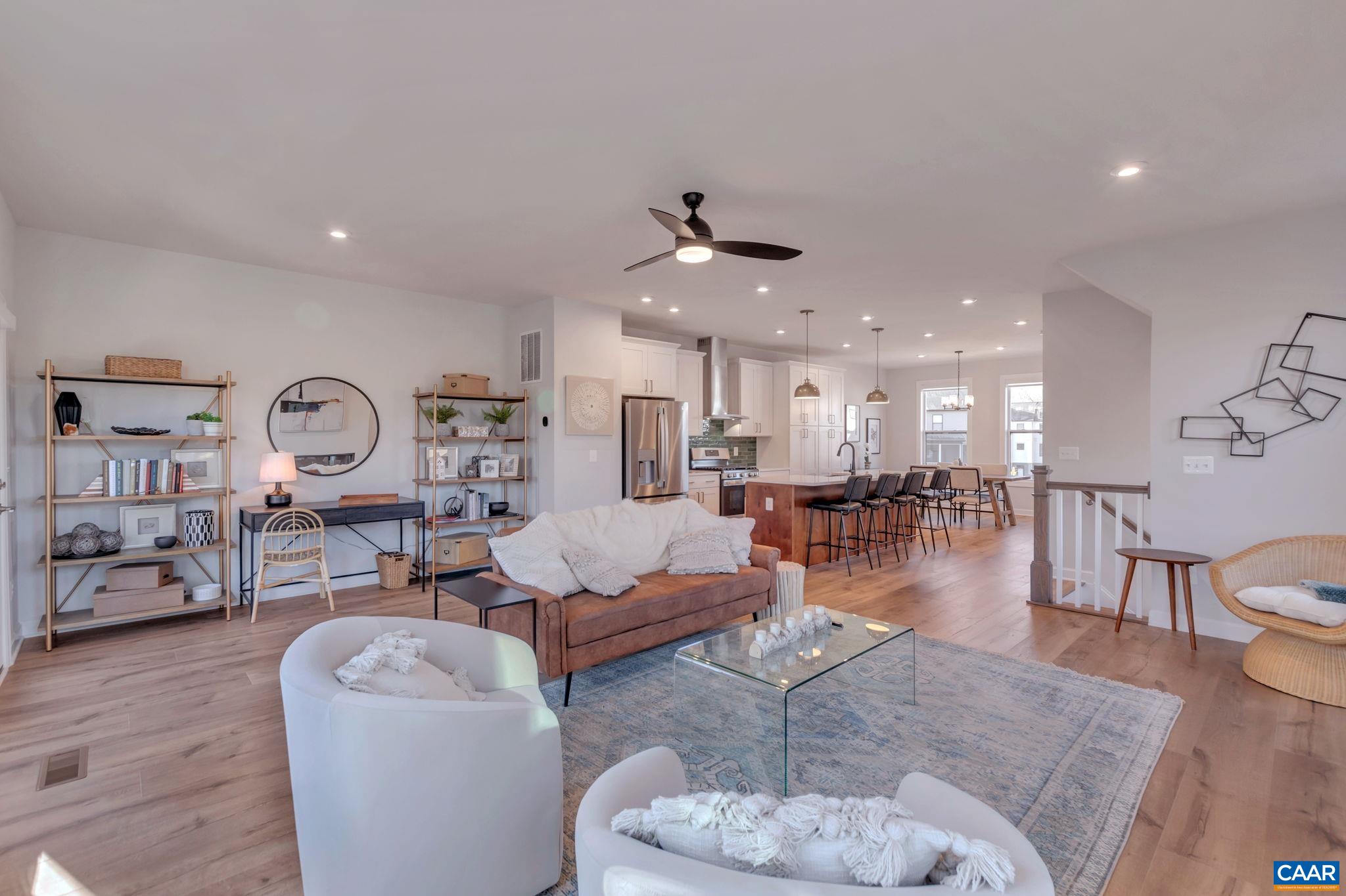 1842 Fowler Street Charlottesville, VA 22901 - Photo 24 of 44 a living room with furniture a rug and kitchen view
