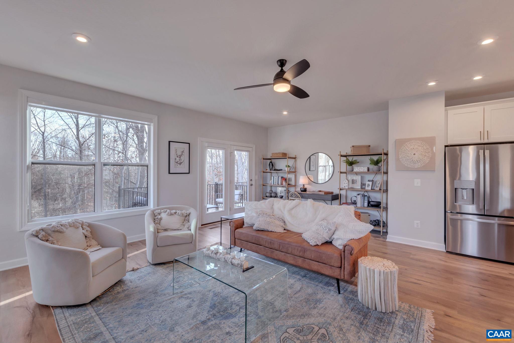 1842 Fowler Street Charlottesville, VA 22901 - Photo 26 of 44 a living room with furniture fireplace and a large window