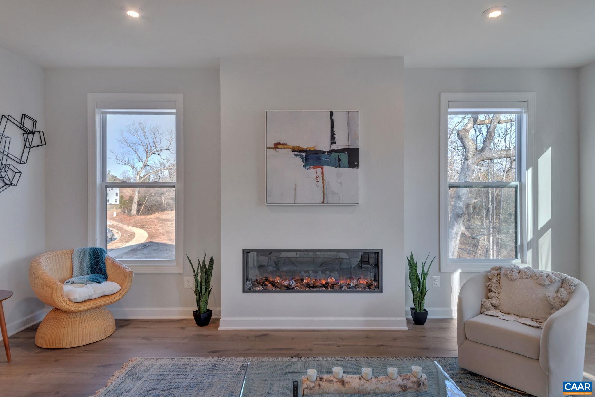 1842 Fowler Street Charlottesville, VA 22901 - Photo 27 of 44 a living room with furniture and a fireplace