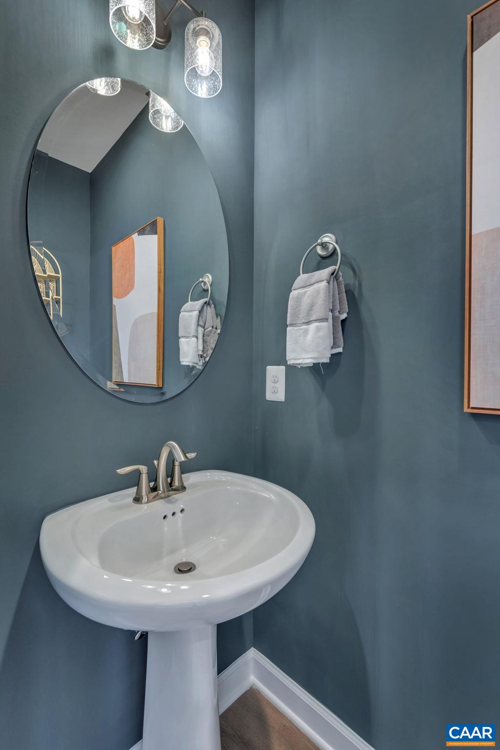 1842 Fowler Street Charlottesville, VA 22901 - Photo 29 of 44 a bathroom with a sink and a mirror