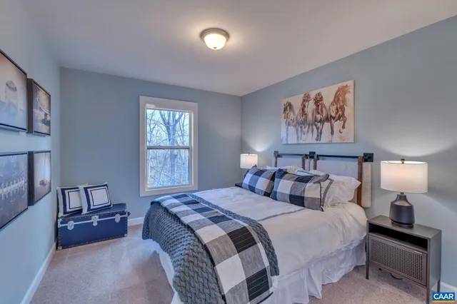 a bedroom with bed and window