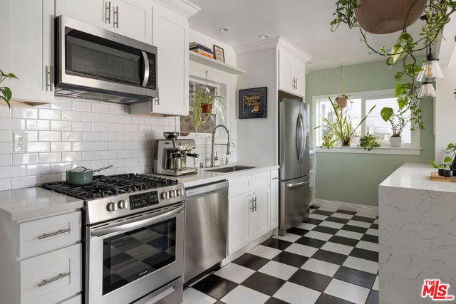 a kitchen with a stove and a microwave