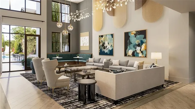 a dining room with furniture a large window and a chandelier