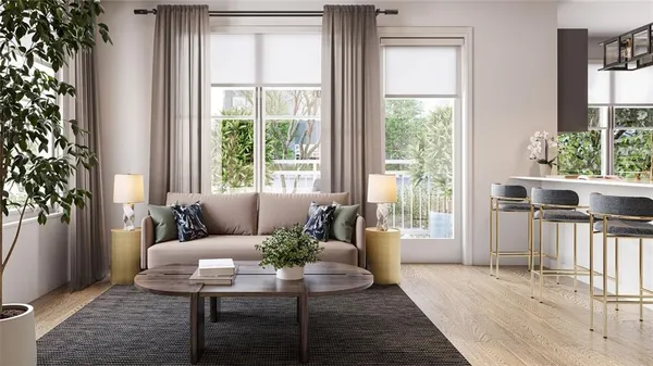 a living room with furniture and a potted plant