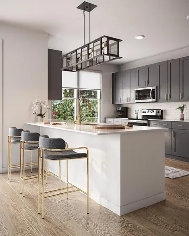 a kitchen with kitchen island granite countertop a sink a counter top space appliances and cabinets