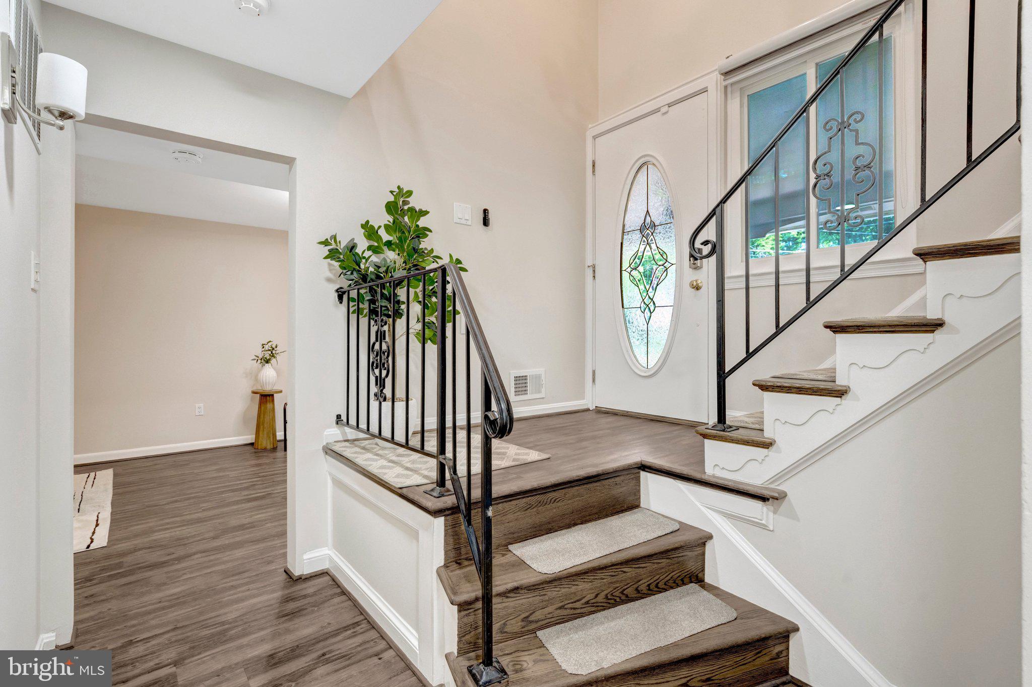 8213 Springfield Village Drive Springfield, VA 22152 - Photo 4 of 25 Inviting entryway with elegant stairs.