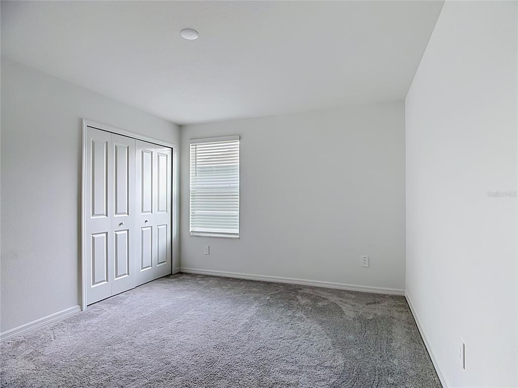 1633 Red Loop Lakeland, FL 33801 - Photo 31 of 60 an empty room with a window
