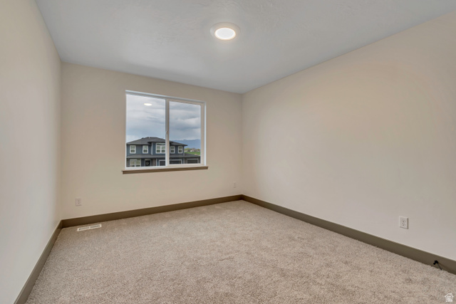 3317 South 1000 West, Unit 6010 Logan, UT 84321 - Photo 29 of 34 Spare room with carpet and baseboards