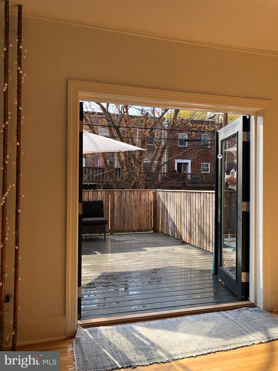 3704 Rexmere Road Baltimore, MD 21218 - Photo 8 of 21 Newly added french doors lead to deck