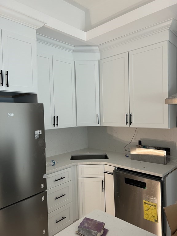 183 West Fifth Street, Unit 1 Boston, MA 02127 - Photo 1 of 16 a kitchen with cabinets appliances and cabinets