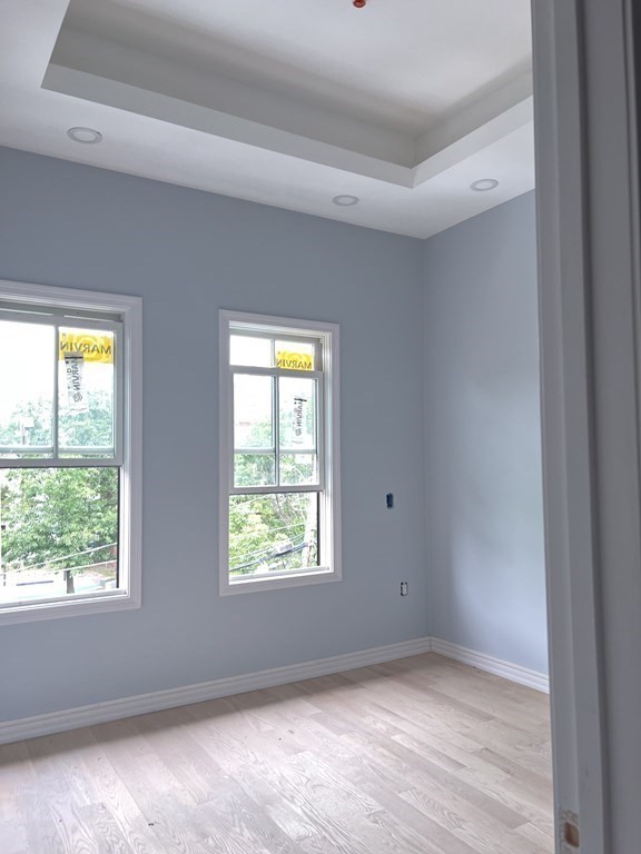 183 West Fifth Street, Unit 1 Boston, MA 02127 - Photo 11 of 16 a view of an empty room with a window