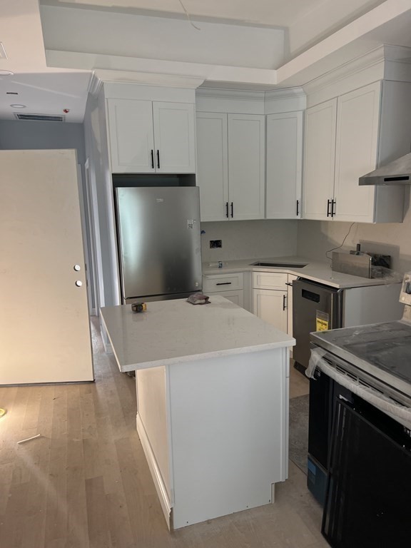 183 West Fifth Street, Unit 1 Boston, MA 02127 - Photo 2 of 16 a utility room with dryer and washer