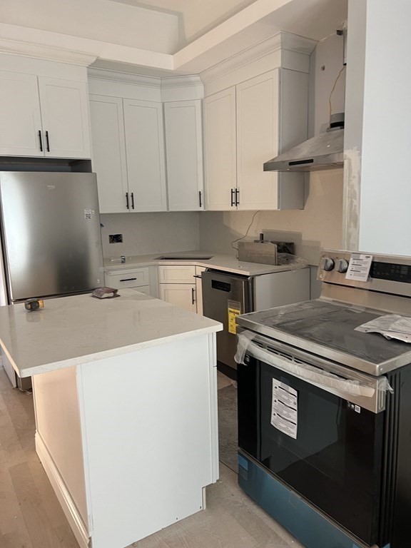 183 West Fifth Street, Unit 1 Boston, MA 02127 - Photo 3 of 16 a utility room with dryer and washer
