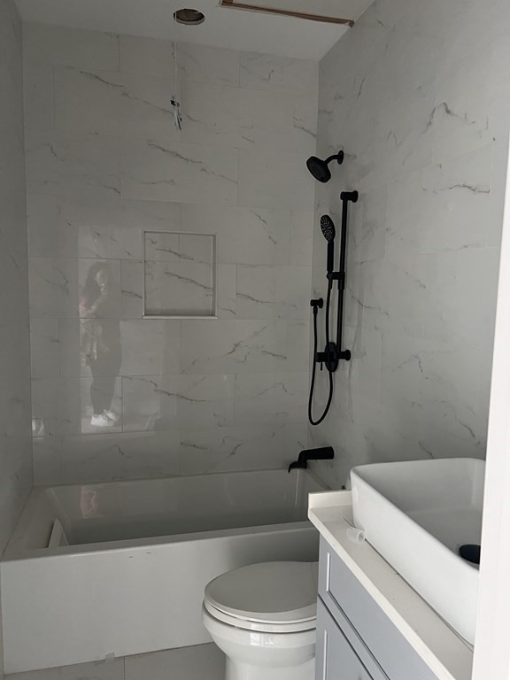 183 West Fifth Street, Unit 1 Boston, MA 02127 - Photo 9 of 16 a bathroom with a toilet and a shower