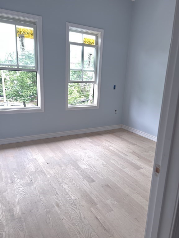 183 West Fifth Street, Unit 1 Boston, MA 02127 - Photo 10 of 16 an empty room with a window