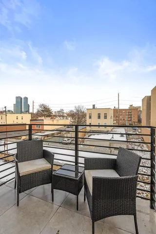 a view of roof deck with seating space and barbeque oven