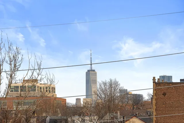 a electric light wire hanging over a city street