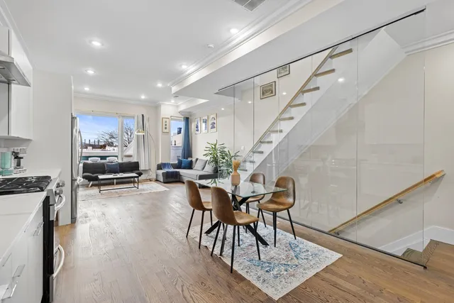 a view of a dining room with furniture window and wooden floor