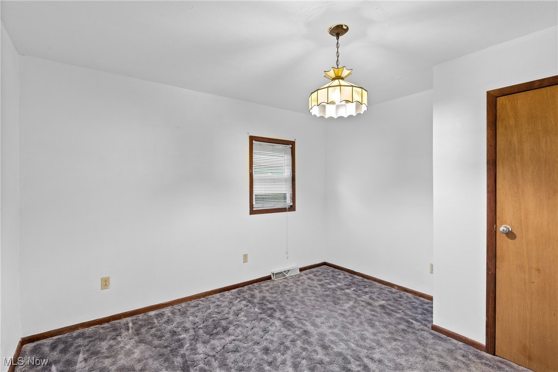 102 Potrock Road Wellsburg, WV 26070 - Photo 15 of 42 Unfurnished room featuring dark colored carpet and baseboards