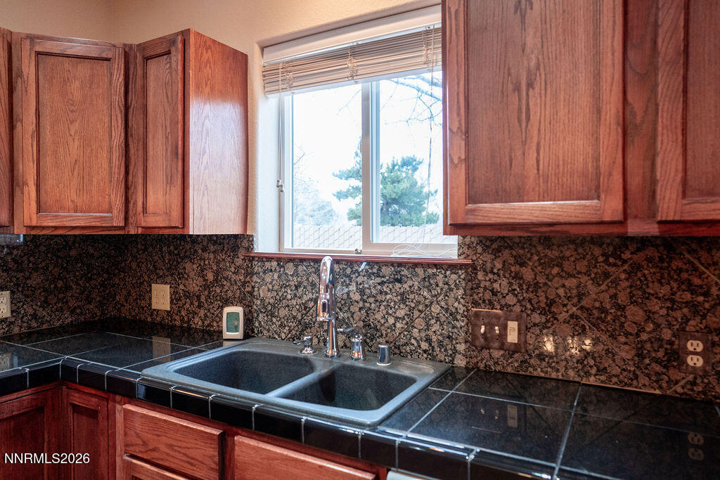 2931 Airport Road Carson City, NV 89706 - Photo 11 of 35 a kitchen that has a sink and a window