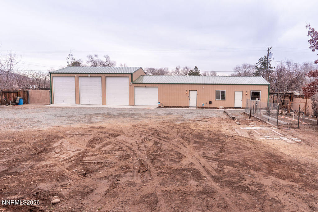 2931 Airport Road Carson City, NV 89706 - Photo 20 of 35 a front view of a house with a yard and lake view