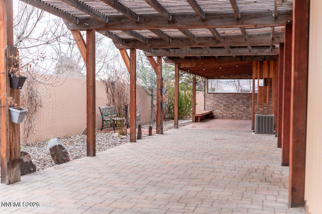 2931 Airport Road Carson City, NV 89706 - Photo 24 of 35 a view of a porch with furniture and a backyard