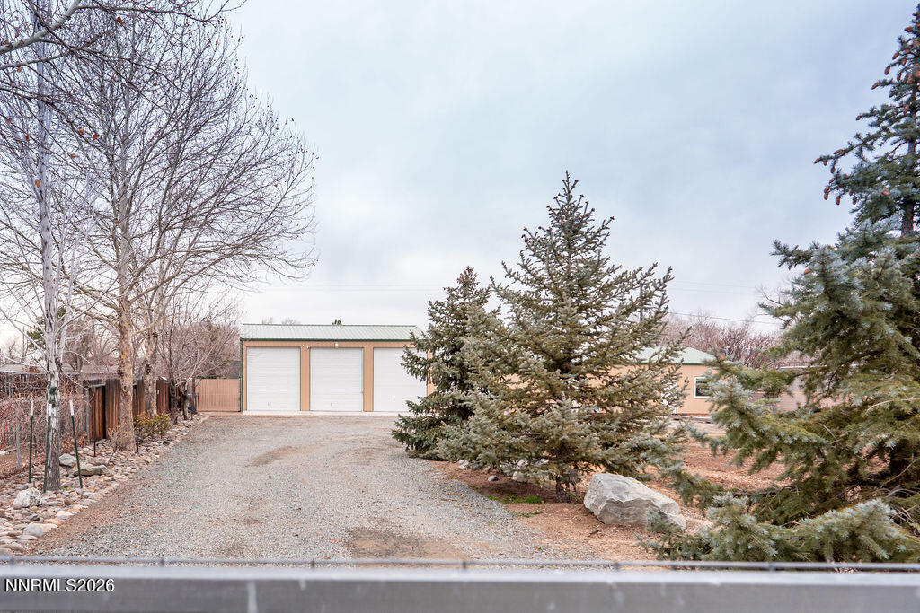 2931 Airport Road Carson City, NV 89706 - Photo 29 of 35 a view of a house with a backyard