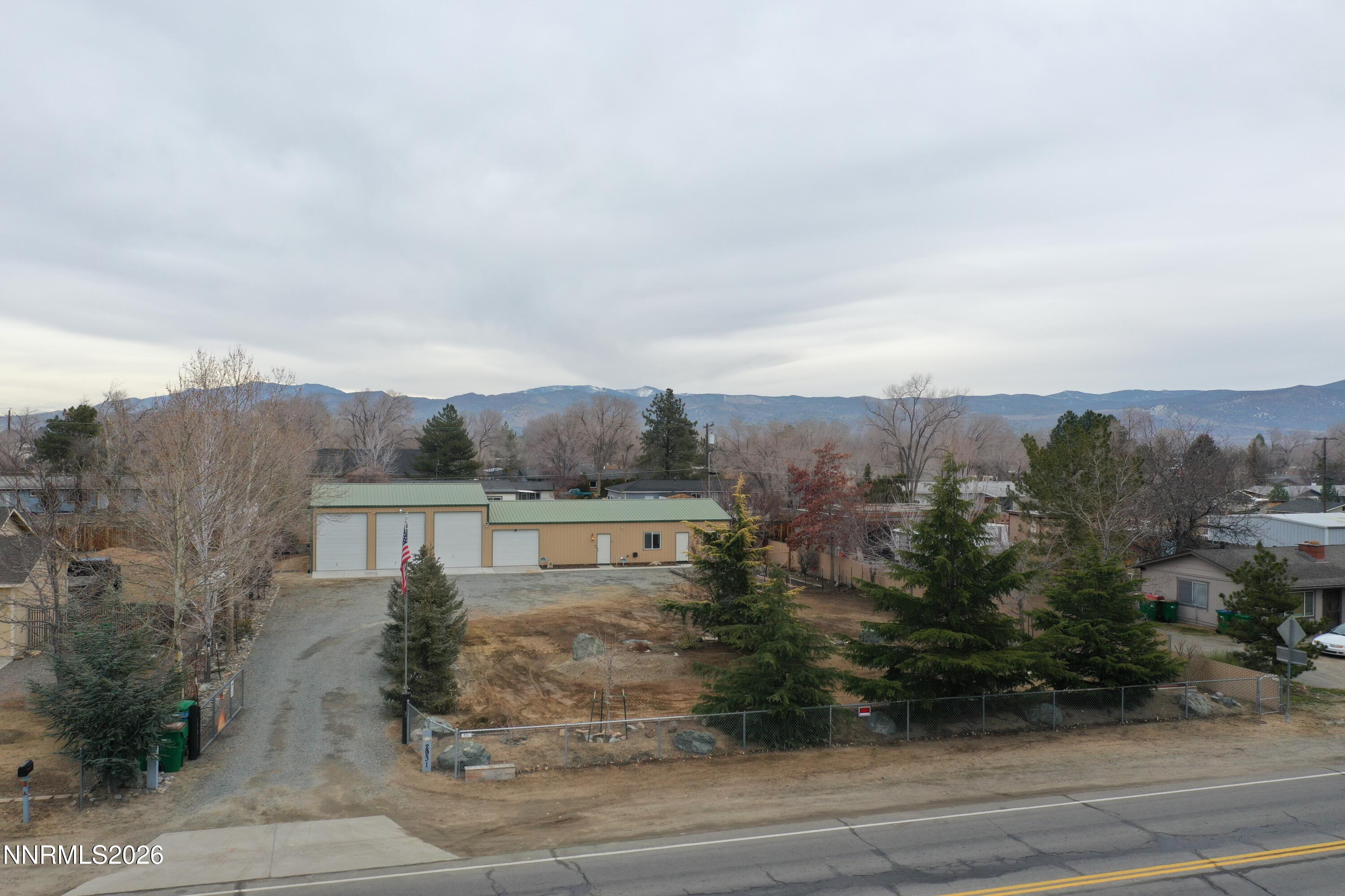2931 Airport Road Carson City, NV 89706 - Photo 31 of 35 an aerial view of house with yard and mountain view in back