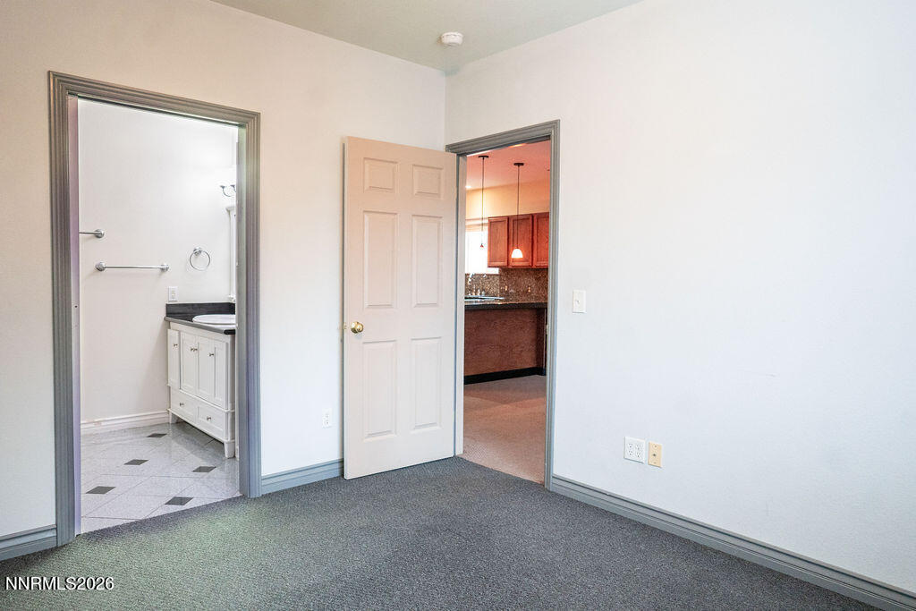 2931 Airport Road Carson City, NV 89706 - Photo 7 of 35 an empty room with closet and mirror